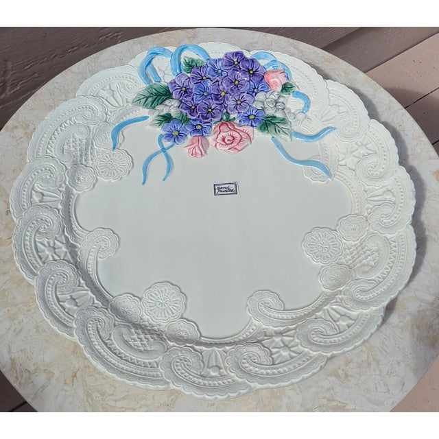Here is a vintage platter in the majolica style. An all-white backdrop sets the stage for a thick lace border and a...