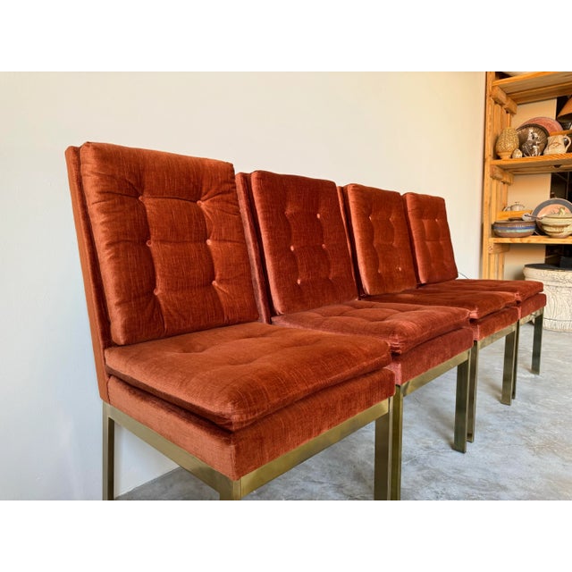 We are delighted to offer for sale this Stunning set of four Mid-century Modern orange chenille velvet and shiny brass...
