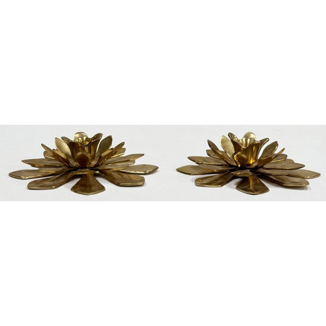 Vintage brass floral motif candlestick holder pair. Each holds a single taper candlestick. Lovely patina.