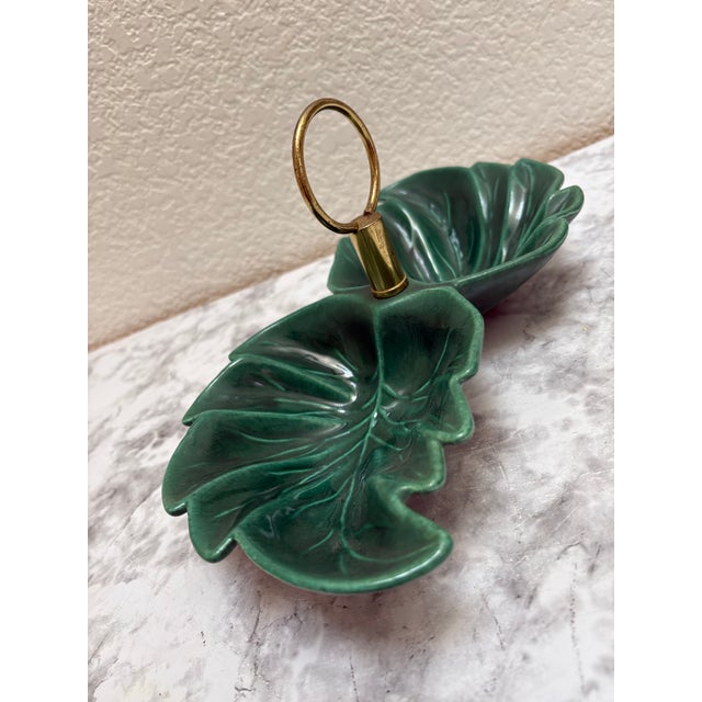 Vintage 1950s green ceramic leaf decor and serving tray. Brass loop handle and textured large leaf motif trays for candy,...