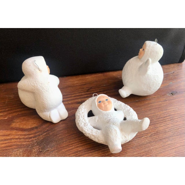 This vintage trio of mid-century style Snowbabies brings a touch of retro charm to any holiday display. Most likely...