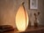 Elegant "Pinguino" Murano glass table lamp, made in Italy in the 1980s. This piece stands out for its organic, sculptural...