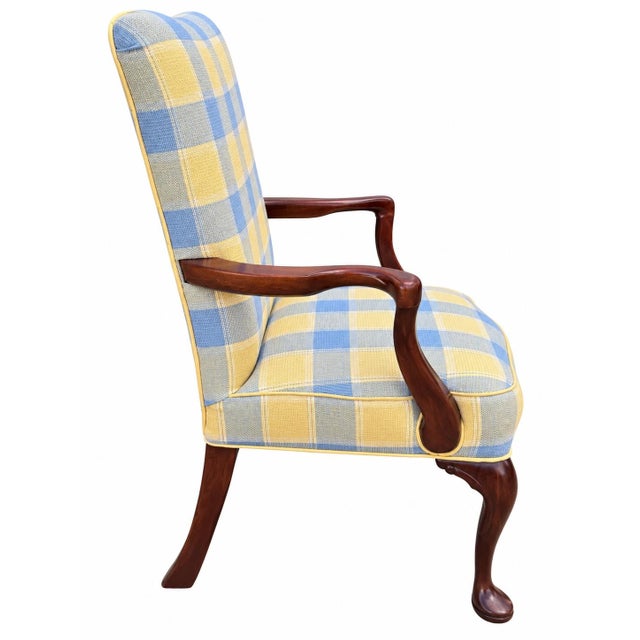 Beautiful vintage English-style armchair upholstered in a charming blue, soft yellow, and cream plaid. The classic...