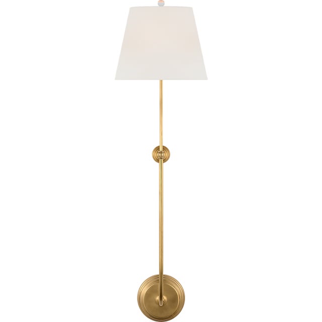 Wyatt 39" Statement Sconce in Hand-Rubbed Antique Brass with Linen Shade Designer: Suzanne Kasler Finish: Hand-Rubbed...