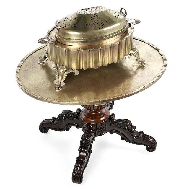 This Berber brass brazier, placed on its original tray, was subtly assembled by craftsmen on a 19th century mahogany table...