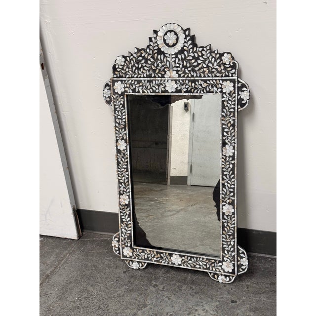 Design Plus Gallery presents a Moroccan Style Mother-of-Pearl Inlaid Floral Wall Mirror. This decorative wall mirror has a...