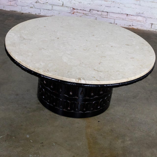 Fantastic vintage Brutalist Heirloom coffee table by Weiman composed of a carved and blackened cylindrical pedestal base...