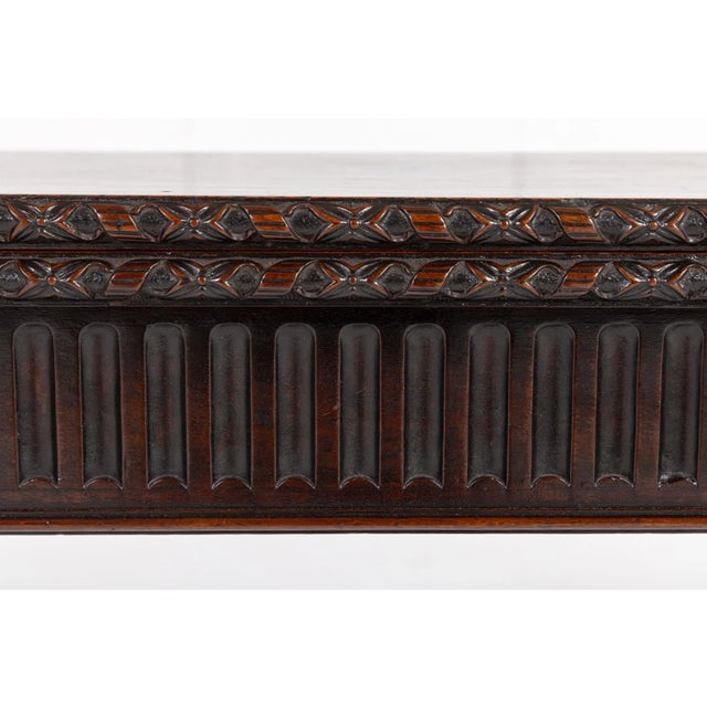 A Beautifully Carved English George III Period Mahogany Tea Table. This fine table opens on a single gate leg mechanism,...