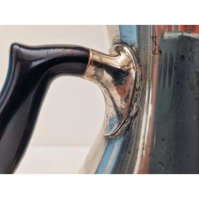 Set consisting of tea & coffee pot, silver plated. The set is reminiscent of designs by Carl Cohr, but is not hallmarked....