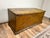 A charming 18th century New England six-board pine blanket box retaining its original or very early mustard grain-painted...