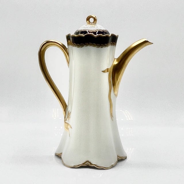 A refined 13-piece demitasse coffee service by haviland & co., limoges, circa 1900. Hand-decorated in cobalt blue and...