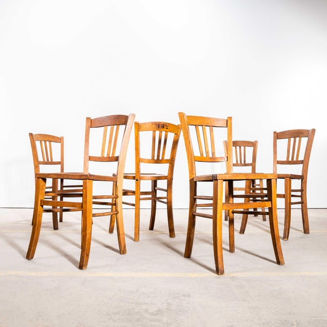 1940’s French Farmhouse Dark Oak Dining Chairs. The French farmhouse dining chairs in a dark oak bring timeless elegance...