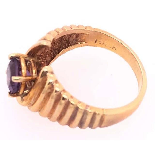 14 Karat Yellow Gold With Center Amethyst Dome Fashion Ring Size 7 6 grams total weight.