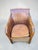A unique vintage club chair with a striking, sculptural form, combining natural materials and artisanal craftsmanship. The...