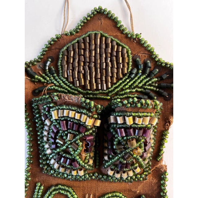 Marvelous 1910 (dated) Native American beaded wall pocket. Hangs on wall with thread self hanger. Charming design. bead...