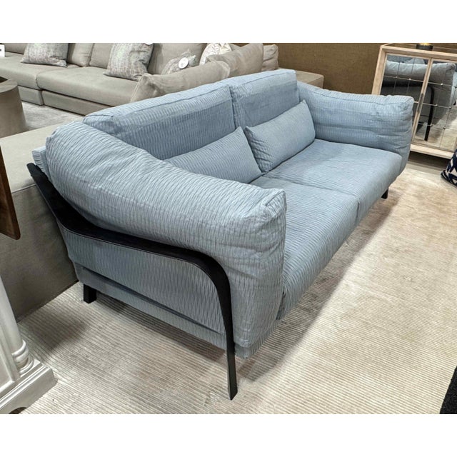 Ligne Rose City Loft Loveseat. Features a slip-cover style seat cushions upholstered in a textured-stitched blue fabric,...