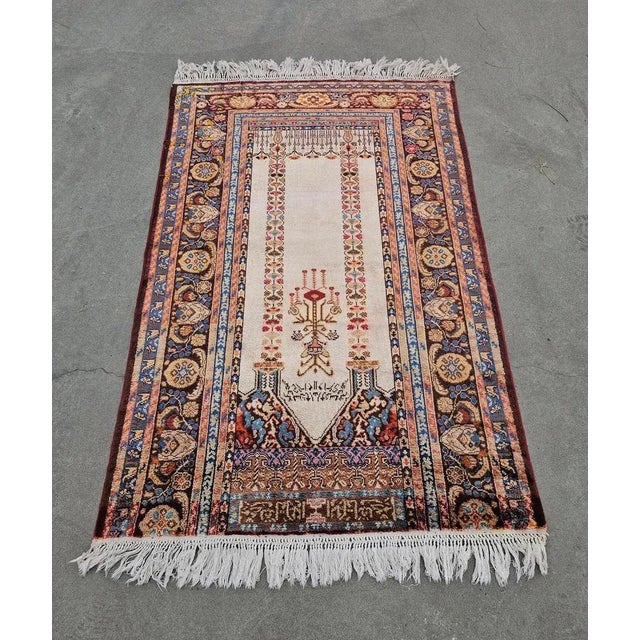 In this listing you will find a spectacular vintage Western Anatolian hand-knotted silk prayer rug. This Panderma rug...