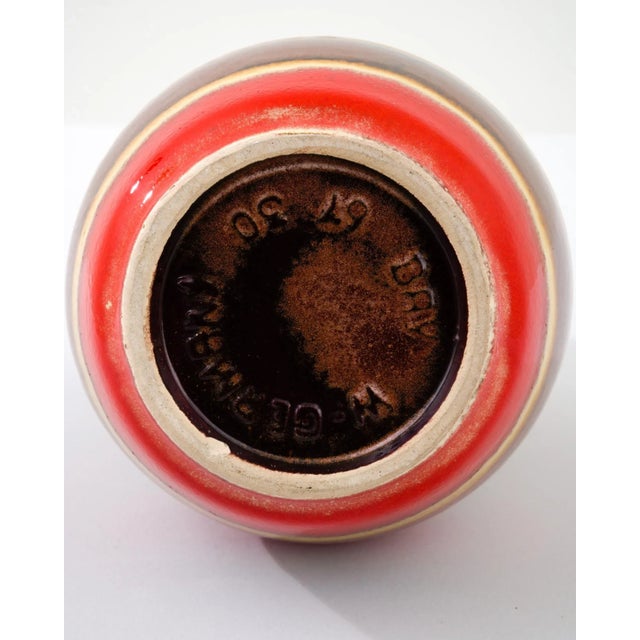 A ceramic vase from mid-20th century Germany. Neither large nor small, this studio made pot reflects the hand-held, and...