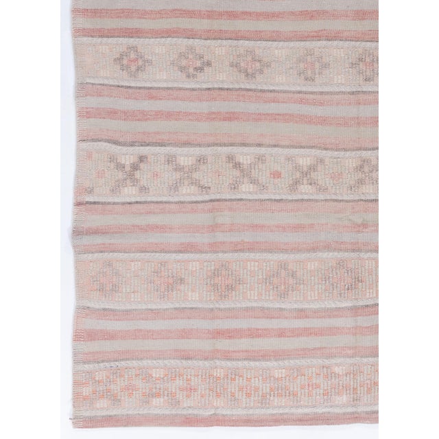 This vintage Turkish flat weave Kilim is hand-woven, showcasing both simplicity and boldness. Its contemporary appeal...