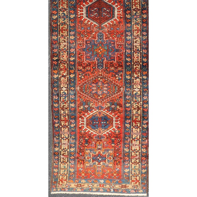 Measures: 3'3 x 14'0 Antique Serapi Runner With Bold Geometric Medallions and Rich Tribal Design Motifs 3'3" X 14'0"....
