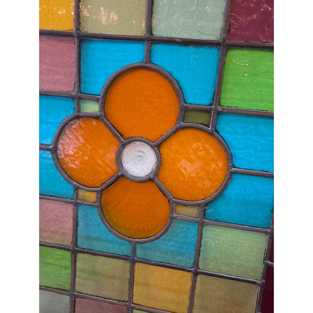 A very nice solid not flimsy stained glass flower with hand blown rondel glass. Glass is thick and all hand made pieces.