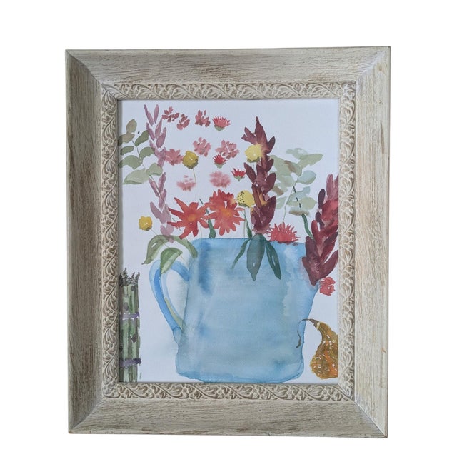 An original Still Life watercolor painting featuring a floral arrangement in a watering can and a pear off to the right...