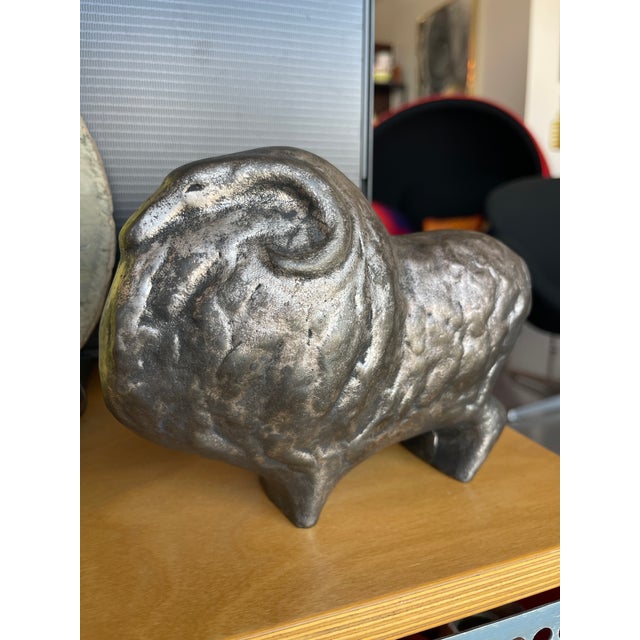 Large, broad form metal ram sculpture. Primitive Scandinavian style form with formed details on all sides. Display ready...
