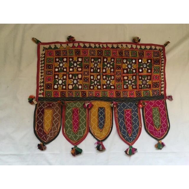 A vintage hand-embroidered mirrored cotton door or window valance with ribbon tassels. One of a kind. Purchased in Jaipur,...