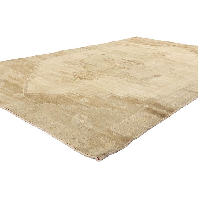 51381 Vintage Turkish Oushak Rug, 06'06 x 10'11. Bathed in the faded warmth of Anatolian sunrises, this hand-knotted...