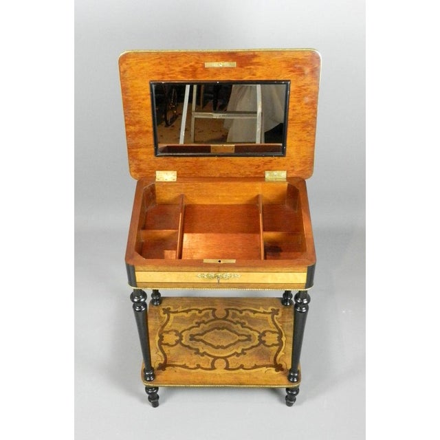 - Beautifully decorated marquetry work table featuring a floral motif to the central panel - The hinged top and lower...