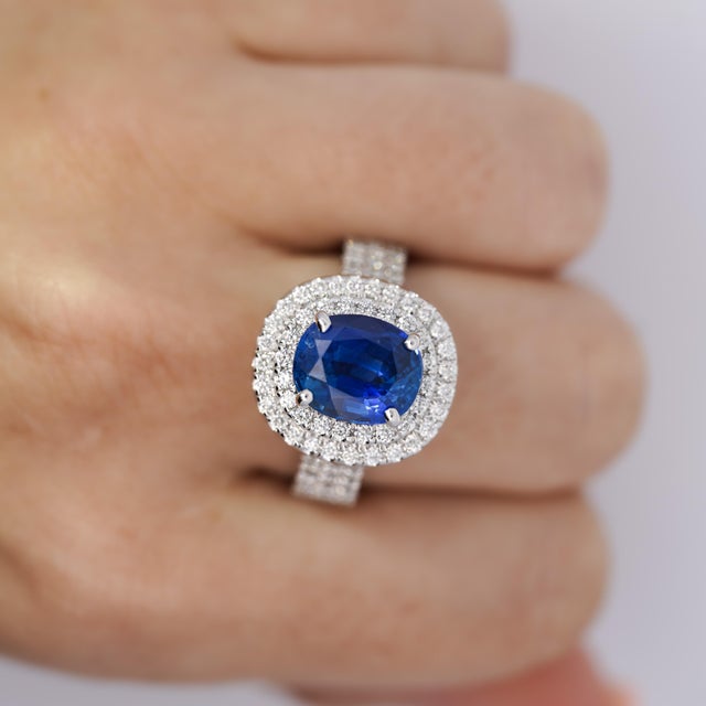 GRS Certified 4.73 Carat Blue Sapphire of Ceylon Origin with Pave Set Double Round Cut Diamond Halo. Set in 14K white...