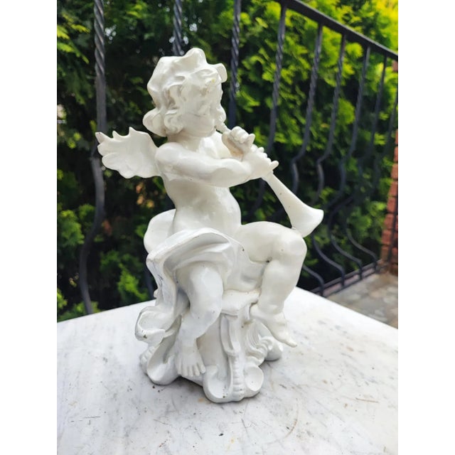 Angel, Cupid playing the flute, vintage from the 70s-80s, dimensions: height 28.5 cm, width 20.7 cm, depth 19 cm.