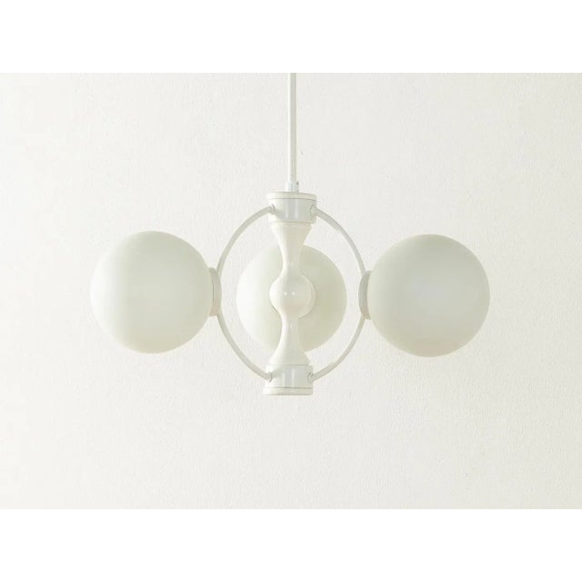 3-flame Space Age ball lamp from the 1970s. High-quality metal frame painted in white with lampshades made of opal glass...