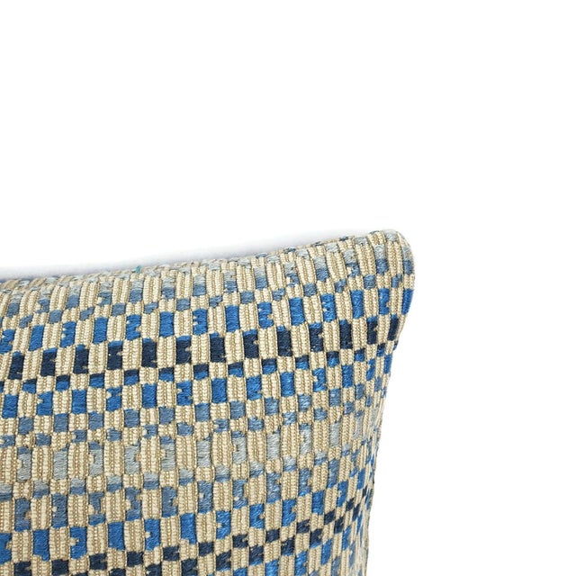 From Manuel Canovas is Daksha in the color Ciel pillow cover. Tanish gray chenille with navy, blue, and light blue color...