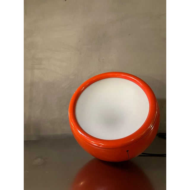 Table and floor lamp by Studio Tetrarch for Artemide, 1970s, likely a first edition made of lobster-colored painted...