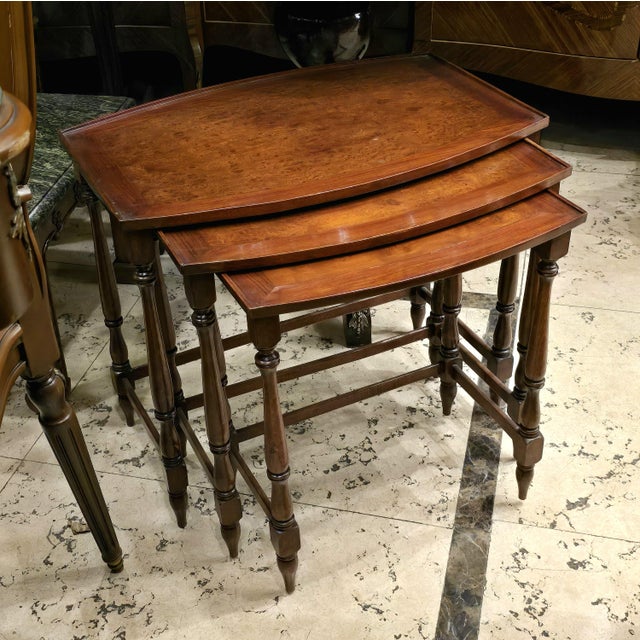 Add timeless European character to your interior with this elegant set of three French-style nesting tables. Crafted...