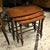 Add timeless European character to your interior with this elegant set of three French-style nesting tables. Crafted...
