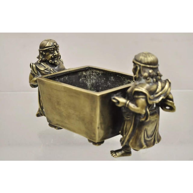Antique Chinese Bronze Foreigner Figural Censer Ming Xuande Mark Ming to Qing. Item features two servants carrying a...