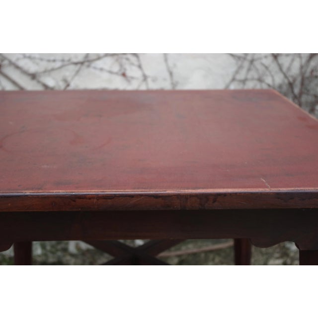 Dark wood table with legs turned and worked.