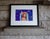 In "Transitions," a young woman gazes thoughtfully over her shoulder, embodying a sense of introspection amid a vibrant...