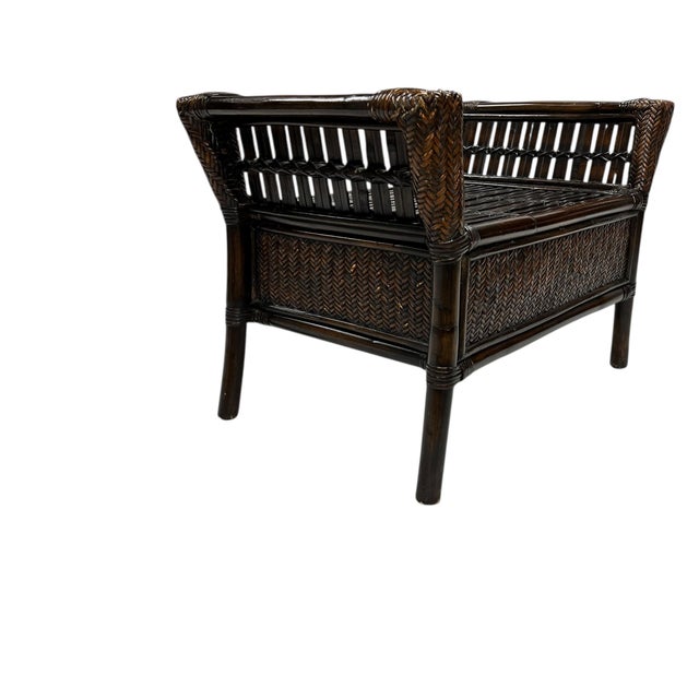 Vintage bamboo and woven rattan ottoman / footstool. Use as is or add a cushion. Has reenforcement underneath the split...