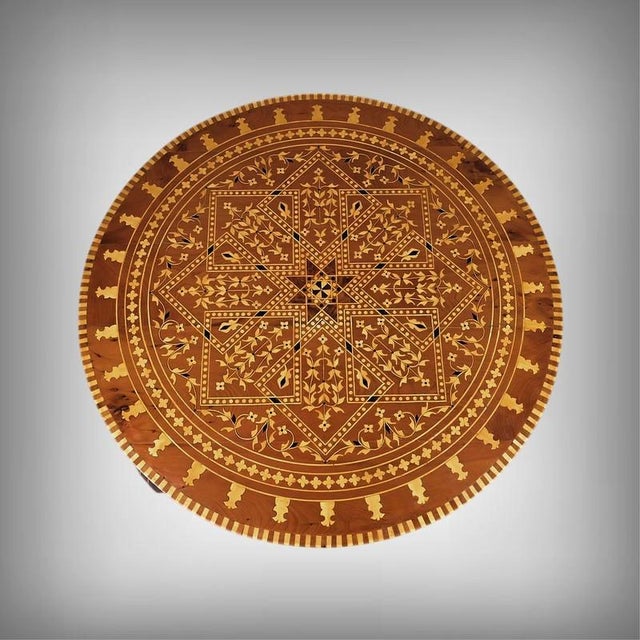This Moroccan Thuya wood table is distinguished by its exquisite marquetry, where geometric and floral motifs are...