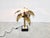 Beautiful torch cut brass palm tree table lamp by Maison Jansen. This palm lamp has a top mounted light point. Base is...