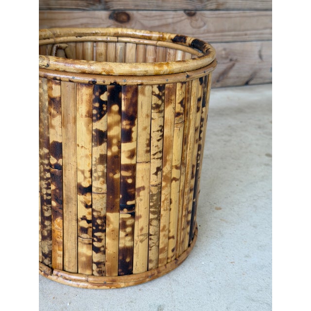 Add a touch of Old Florida charm with this vintage tortoise bamboo wastebasket or planter. Crafted with beautifully...