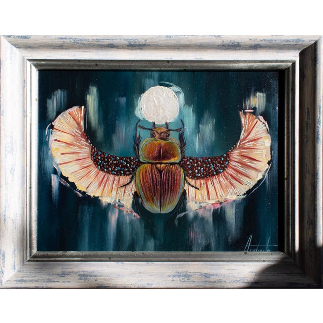 Scarab Totem presents a striking portrayal of a scarab, its vibrant colors and intricate details drawing the viewers eye....