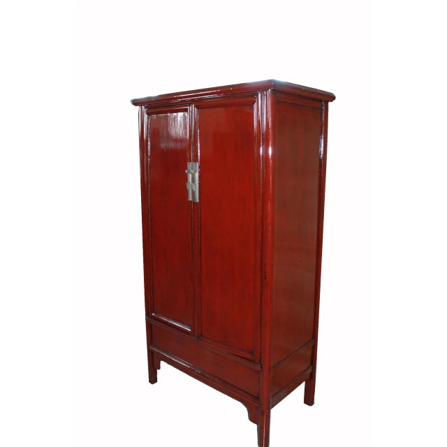 This lovely and elegant Chinese red armoire cabinet was called “noodle cabinet” because the round moldings surrounding the...