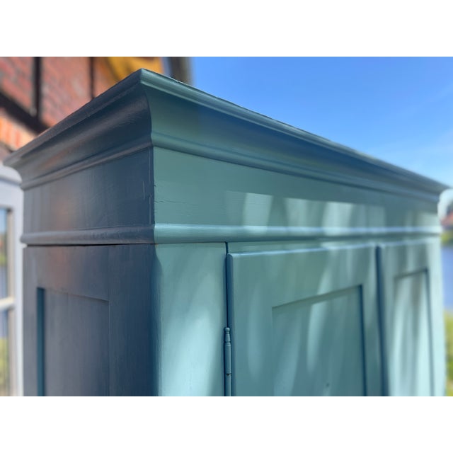 This charming antique wardrobe, designed for disassembly, has been repainted by us. It has been fully enclosed. Width: 140...