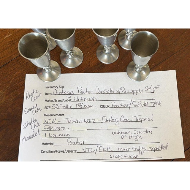 Vintage pewter cordials feature a distinctive pineapple-textured stem, bringing a touch of tropical hospitality to any...