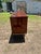 A striking French Art Deco modern sideboard from the 1940s, crafted in richly figured exotic wood with stunning geometric...