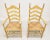 A pair of Cottage / Farmhouse style dining armchairs by Cape Ann Chairs. Maple with carved arched ladder back design,...